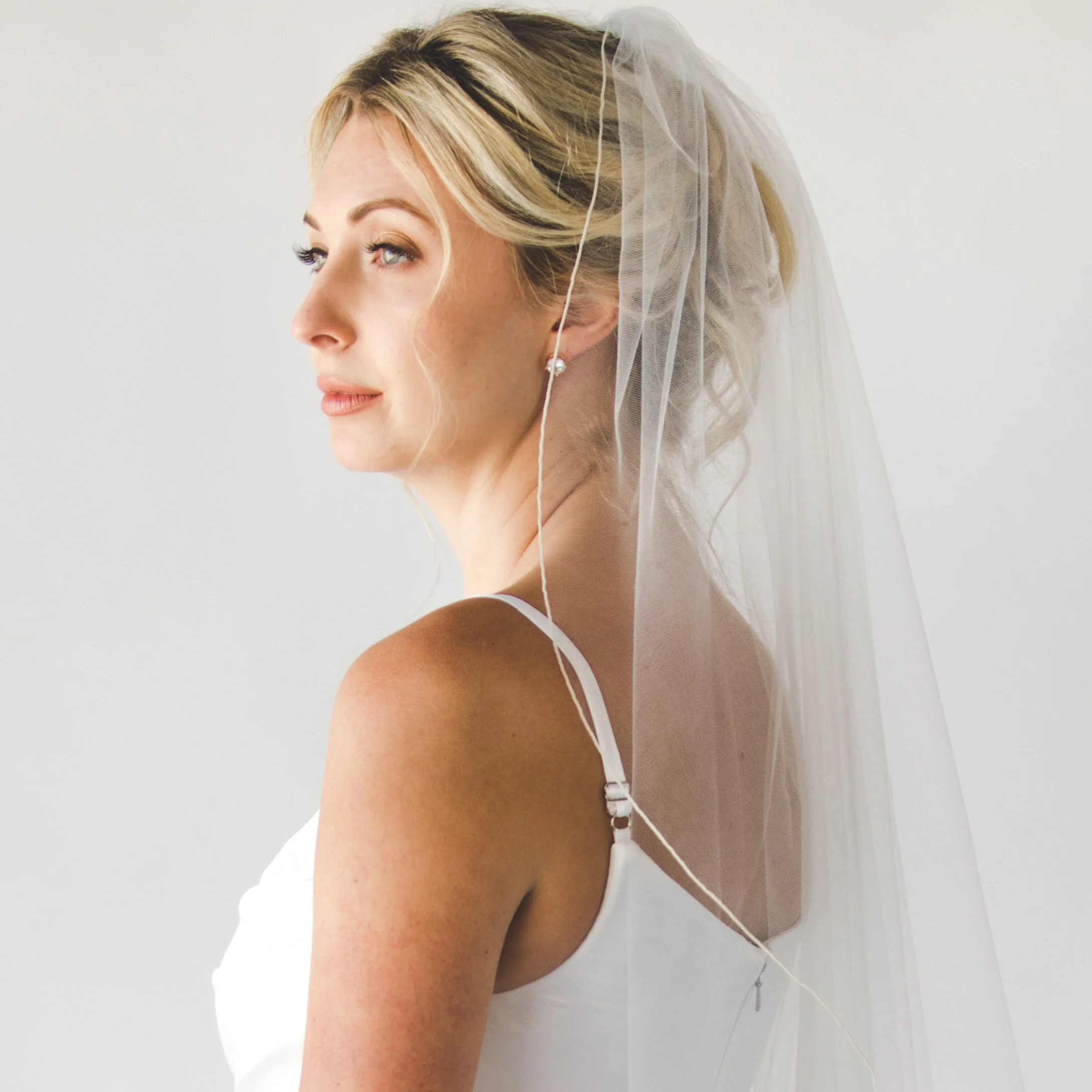 Bella wavy angel wing cut veil with stitched edge by Justine M